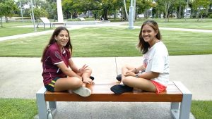 2 teenagers in a park in Cairns, Queensland, saying Hi.